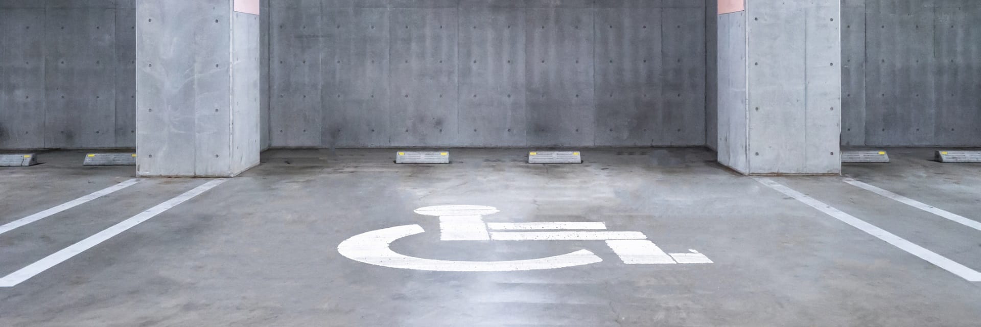 empty Handicapped Parking garage underground, interior shopping mall at night